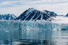 Arctic waters front Lilliehook Glacier and snowy mountains beyondSpitsbergen Island-Norway Art Print